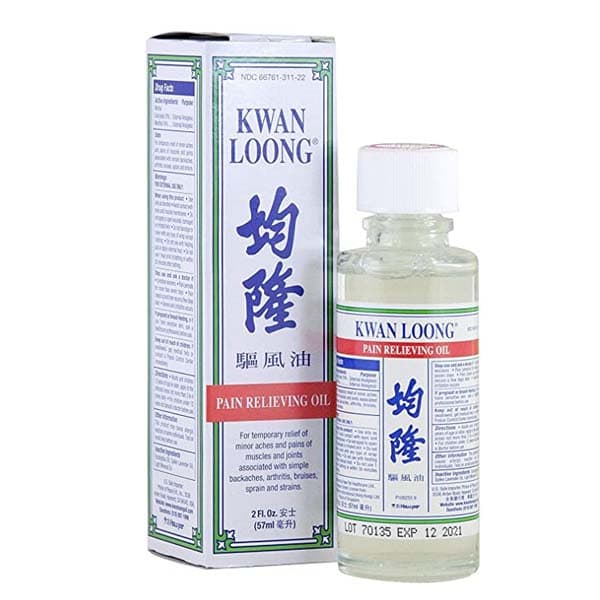 Clear bottle with 2 fluid ounces of oil, chinese and english text.